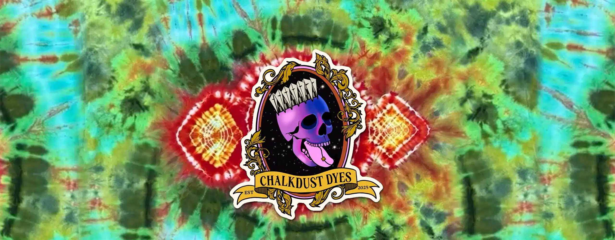 Chalkdust Dyes logo sticker on a hand-dyed red, yellow and green tie-dye shirt